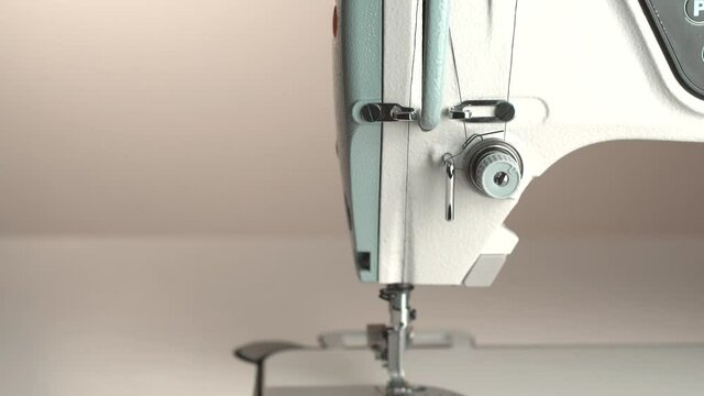 Close up panning footage of white sewing machine