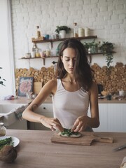 young woman is making a healthy breakfast in her kitchen, vegan
