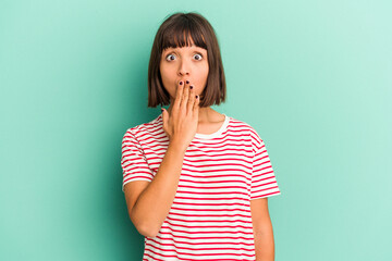 Young mixed race woman isolated on blue background praying, showing devotion, religious person...