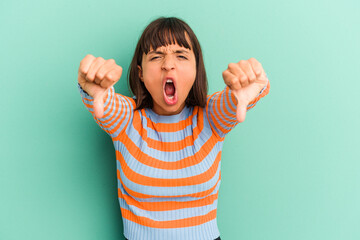 Young mixed race woman isolated on blue background showing thumb down and expressing dislike.