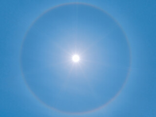 Sun halo on a clear blue sky