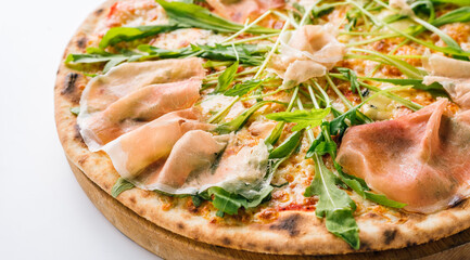 Pizza with prosciutto and arugula close-up. Long banner