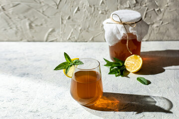 Raw fermented homemade alcoholic or non alcogolic kombucha superfood. Ice tea with healthy natural...
