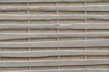 street fence made of scraps of white boards