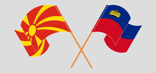 Crossed and waving flags of North Macedonia and Liechtenstein