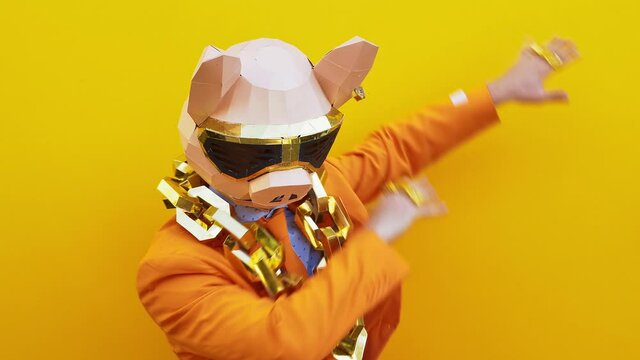 Cool man wearing 3d origami mask with stylish colored clothes 