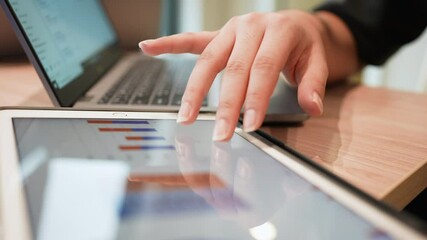 slow motion businessman hand point on dashboard statistic chart on digital tablet screen in office room to planning or analyzing the company's profit or business strategy for future technology - Powered by Adobe