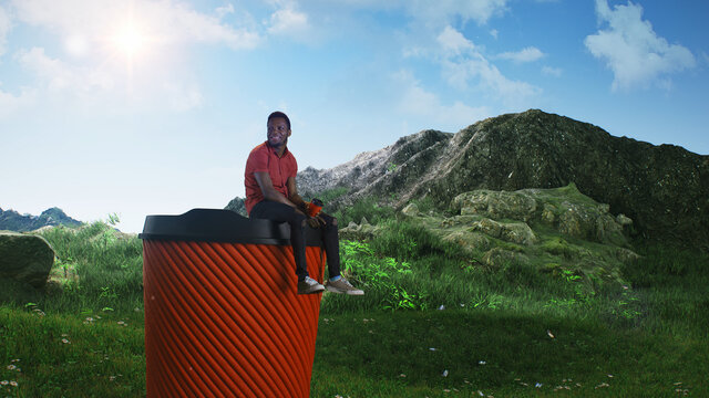 Black man drinking coffee on huge cup in nature