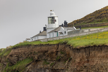 Fototapeta na wymiar Whitby Lighthouse in Yorkshire, UK