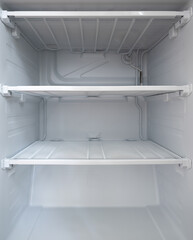 empty clean freezer in the fridge. empty shelves in the fridge