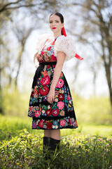 Young beautiful slovak woman in traditional dress. Slovak folklore