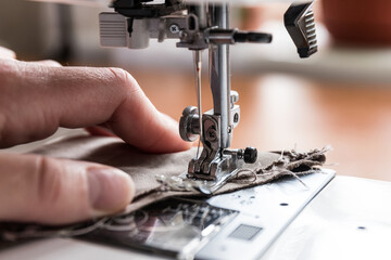 Production line sewing machine. Needle and footstep detail