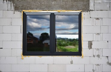 plastic window mounted on a building under construction