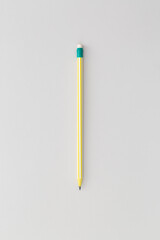 Pencil on grеy background. Top view. Flat lay. Back to school concept.