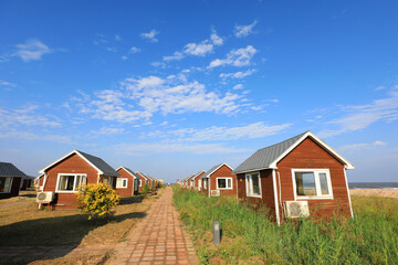 The wooden house in the background of blue sky
