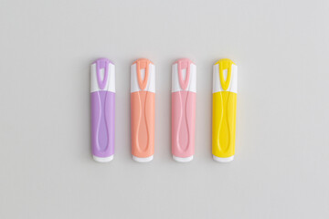 Multicolored marker on a grey background. Top view with copy space. Flat lay. Back to school concept.