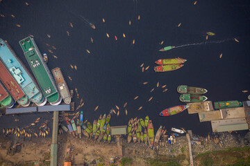 Aerial view of traditional wooden boats anchored at Old Dhaka city port along Buriganga river, Dhaka, Bangladesh.