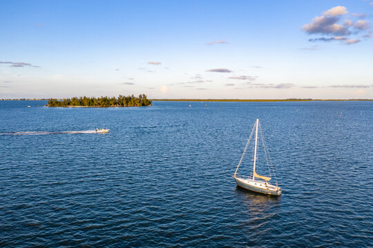Aerial view of a sailing boat off Indian River coastline in Pelican Island Wildlife Reserve, Sebastian Oaks, Florida, United States.