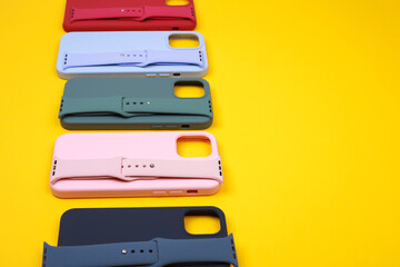 Colored silicone phone cases, complete with watch strap. Set. Up to date technology.Close up of...