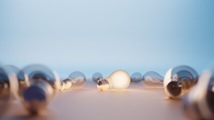 Strewn light bulbs stand out concept with one bulb illuminated with room for text