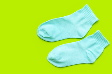 Blue socks on green background.