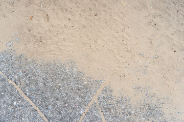 texture of sand and decorative pavement
