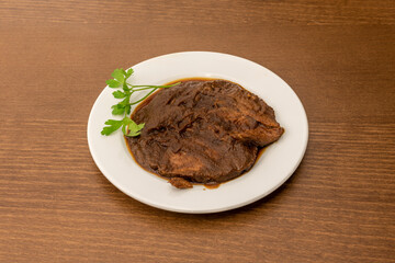 Spanish recipe for beef cheek stewed with parsley