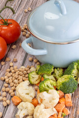 Blue pot and chopped fresh vegetables to prepare a stew