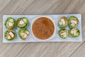 Overhead view of fresh rolls for that vegetarian craving with tofu and dipping sauce
