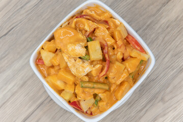 Overhead view of pineapple curry served in bright colors and presented beautifully in a bowl