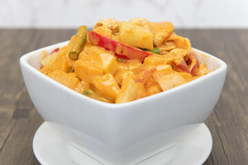 Pineapple curry served in bright colors and presented beautifully in a bowl