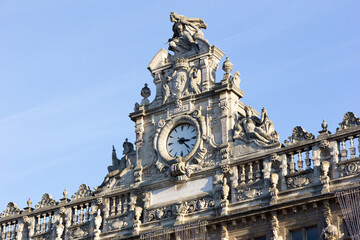 Fototapeta na wymiar Valenciennes, France, 2017/01/05. The clock and statues on the town hall.