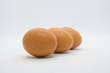 Three brown eggs