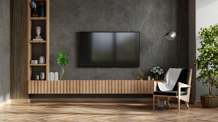 Mockup a TV in modern living room with armchair and plant on concrete wall background.
