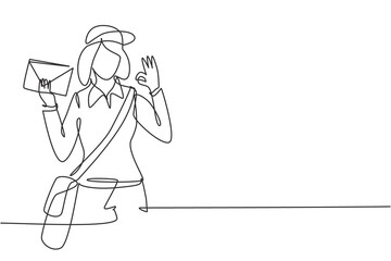 Single one line drawing postwoman wearing hat, sling bag, and uniform with gesture okay holds envelope to delivered to home address. Modern continuous line draw design graphic vector illustration
