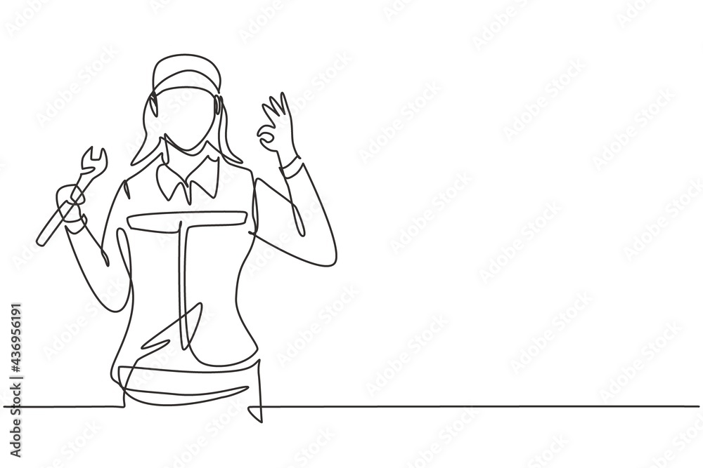 Wall mural Continuous one line drawing female mechanic with gesture okay and holding wrench works to fix broken car engine in garage. Success business concept. Single line draw design vector graphic illustration - Wall murals