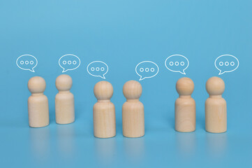 Wooden doll figures with notification icons of message, chatting social media interactions