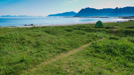 Fototapeta na wymiar Seascape with tent on beach, Lofoten Norway