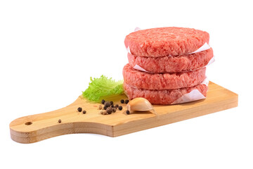 Raw beef patties for making a burger.Isolated on a white background.Selective Focus. - obrazy, fototapety, plakaty