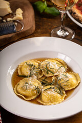 Freshly made brown butter cheese ravioli with sage