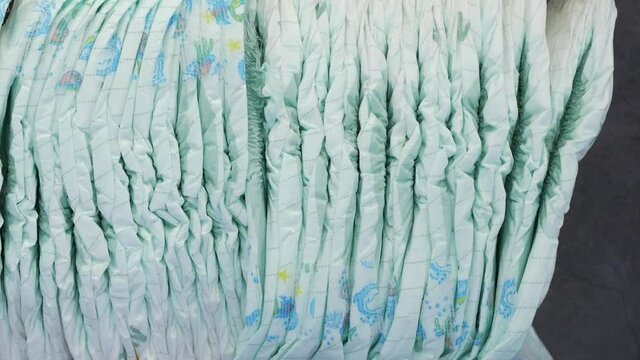 stack of baby diaper on black background ,