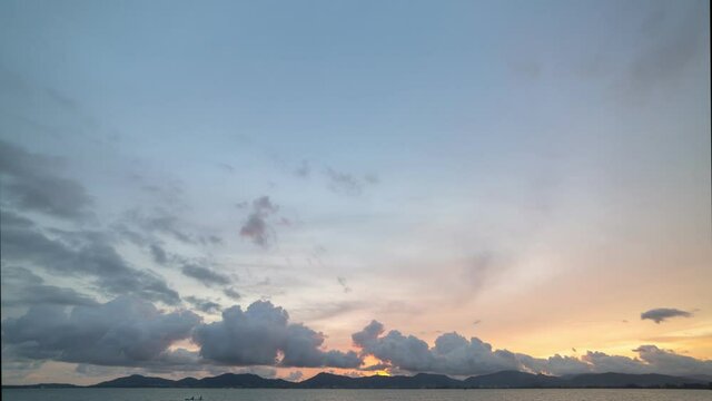 Time lapse Nature video High quality footage Scene of Colorful romantic sky sunset with cloud over the mountain range background .for creative nature and travel concept.