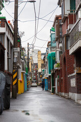 An old residential alleyway in Korea, a residential area built of red bricks.