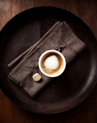 Coffee with milk on dark background. Top view. 