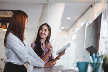 Startup young business colleagues discussing work together on tablet. Coworker collaboration concept