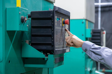 close up hand engineer is checking and maintenance for diesel generator at emergency power supply...