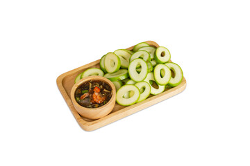 Fresh and sour Mango Local Mango fruit  and sweet fish sauce in a wood plate. Mangifera indica.