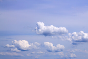 White fluffy clouds on blue sky on a sunny day