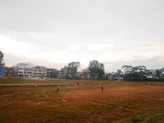 View landscape cityscape village and football soccer field of nepalese for nepali people playing ball at countryside rural at Pokhara hill valley village city of Gandaki Pradesh in Pokhara, Nepal