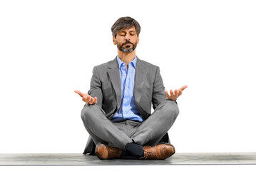 Elegant businessman meditating in the yoga lotus pose
